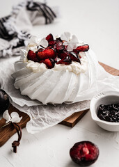 dessert Pavlova cake with cherry plum