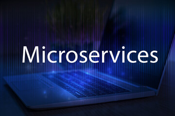 Microservices text on blue technology background with laptop.