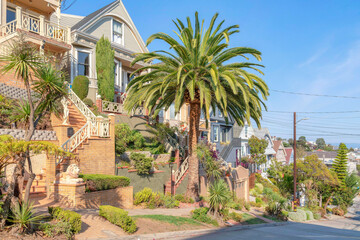 Neighborhood in San Francisco, California with stairs and staues at the front