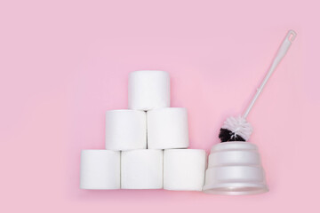 toilet brush and lots of toilet paper