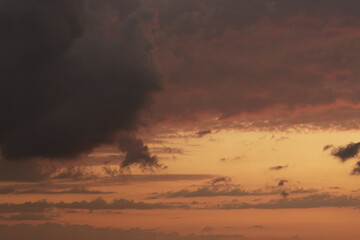 Obraz na płótnie Canvas Soft clouds with orange light during summer sunset