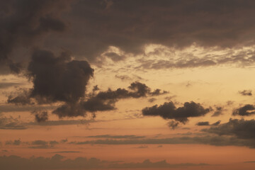 Soft clouds with orange light during summer sunset