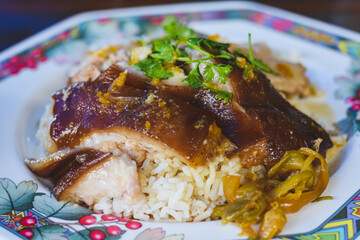 pork leg rice on a plate