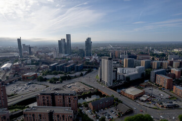 Fototapeta premium Manchester City Centre Drone Aerial View Above Building Work Skyline Construction Blue Sky Summer Beetham Tower