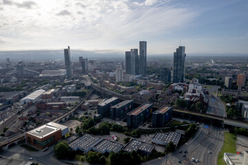 Fototapeta premium Manchester City Centre Drone Aerial View Above Building Work Skyline Construction Blue Sky Summer Beetham Tower