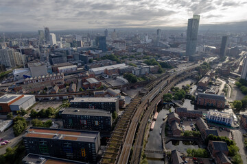 Naklejka na ściany i meble Manchester City Centre Drone Aerial View Above Building Work Skyline Construction Blue Sky Summer Beetham Tower Apartments Estate Agent