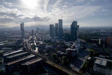 Fototapeta premium Manchester City Centre Drone Aerial View Above Building Work Skyline Construction Blue Sky Summer Beetham Tower Apartments Estate Agent 2022
