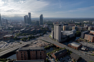 Naklejka na ściany i meble Manchester City Centre Drone Aerial View Above Building Work Skyline Construction Blue Sky Summer Beetham Tower Apartments Estate Agent 2022