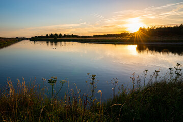 Beautiful sunset over a lake in recreation area Bentwoud, The Netherlands