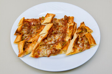 Kiymali pide. Turkish pide with minced meat. Turkish pizza mince pita Pide on white background. Etli ekmek. Kusbasi kasarli, kiymali kasarli, kiymali yumurtali, Bafra, Trabzon, Kusbasili pide.