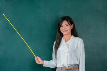 Portrait attractive of smiling Asian Teacher woman teaching student in online classroom, Female teacher present empty on blackboard, High school and back to school concept.