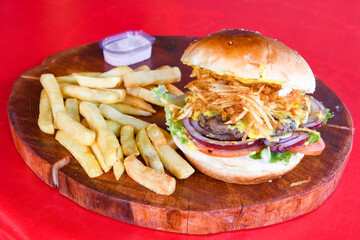 Big tasty burger with beef cutlet on a plate. Crispy chicken burger.