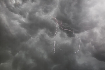 cloudy overcast sky with lightning thunderstorm-