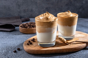 Dalgona coffee, Iced fluffy creamy whipped trend drink with coffee foam and milk.