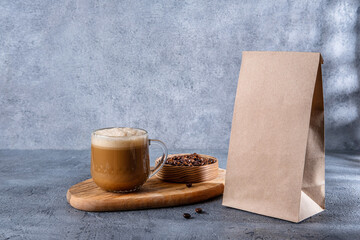 Coffee identity branding mockup. Blank brown craft bag with coffee beans and cup of coffee. Package mockup template for logo, brand, sticker, label.