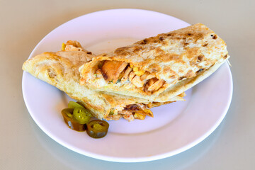 Turkish and Arabic Traditional Ramadan doner kebab with tasty tomato sauce and rice or turkish pilav in white plate on wood table background. ( , Iskender, ekmek arasi pilav ustu doner, doner durum )