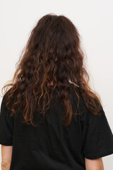 Dry and frizzy natural curly hair that needs hydration. Natural curls before salon treatment. close up. - 521803949