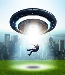 Flying saucer abducting young businessman