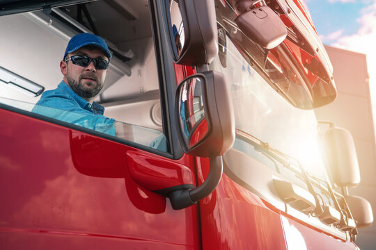 Truck Driver Looking Through The Cab Window