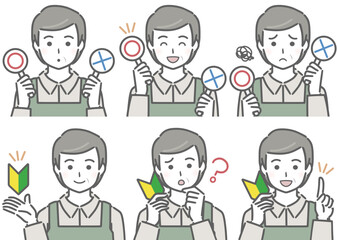 〇✕マークや初心者マークを持つエプロンの中年男性