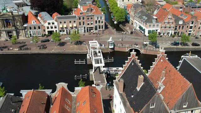 Gravestenebrug bridge in Haarlem near Amsterdam, Netherlands. Aerial view of picturesque dutch city Haarlem in the summer. Sailboats and yachts pass under the drawbridge. Famous place to visit.