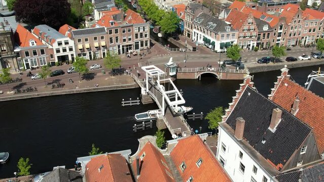 Gravestenebrug bridge in Haarlem near Amsterdam, Netherlands. Aerial view of picturesque dutch city Haarlem in the summer. Sailboats and yachts pass under the drawbridge. Famous place to visit.