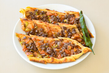 Kiymali pide. Turkish pide with minced meat. Turkish pizza mince pita Pide on white background. Etli ekmek. Kusbasi kasarli pide.