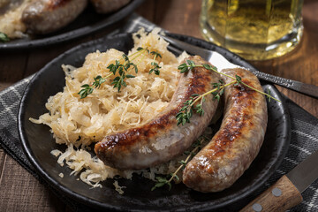 Grilled bratwurst and sauerkraut meal - 521809715