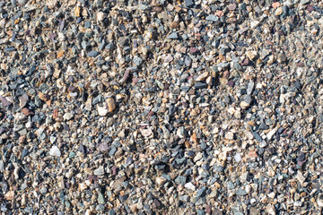 Background from crushed stone and sand. Small gravel stones
