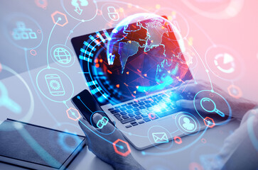 Businessman working laptop and smartphone, earth globe hud and digital icons