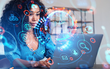 African businesswoman working with laptop, earth globe and hud with glowing icons
