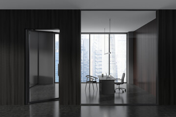Grey office interior desk with armchair behind glass doors, panoramic window