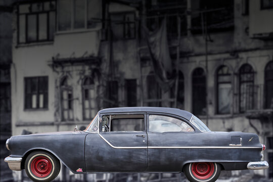 Hannover, Germany, July 23, 2022: Pontiac, side view of classic car from General Motors, with dulled paint and patina against blurred background with broken house
