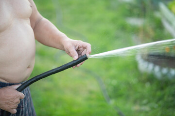 Prostatitis.Men's disease.A figurative image. A man with a water hose.