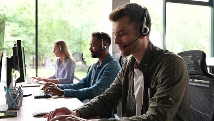 Male representative call center agent in wireless headset helping client, operator working in customer support service - Powered by Adobe