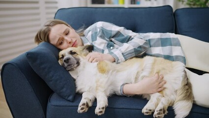 Young woman feeling lonely, hugging her pet for emotional support, companionship
