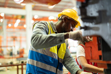 Close up hand industrial industrial plant, Engineer looking of working at industrial machinery setup in factory.