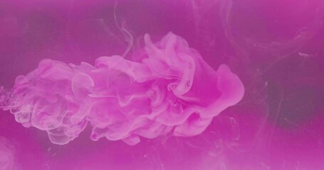 Ink mix in water. Color vapor. Chemical reaction. Neon pink liquid paint dissolving on vibrant fume cloud texture abstract art background shot on RED Cinema camera.