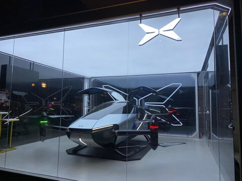 Shanghai,China-August 7th 2022: XPeng Voyager X2 electric Flying Car and brand logo. XPENG Motors is a Chinese company