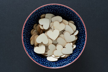 wooden heart shapes in a bowl