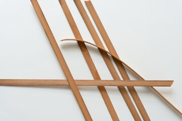 vintage cedar wood straps on a white background