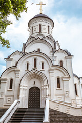 Fototapeta premium Christian church exterior facade of the dome cross summer day
