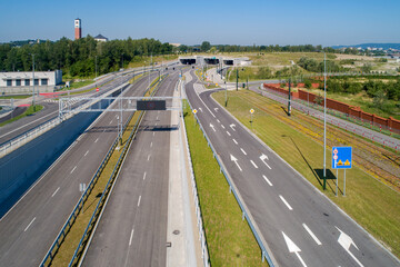 New highway in Krakow, called Trasa Łagiewnicka with multilane road with tunnels for cars and trams, ready to be opened in July 2022. Part of the ring road around Cracow city center. Aerial view