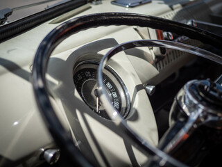 Fototapeta na wymiar Dashboard and steering wheel of old-timer car