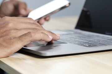 Fototapeta premium Businessman using laptop and smartphone to work Contact the job online. Social media marketing concept.
