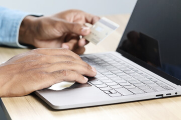 Businessmen shop online using credit cards to pay online.