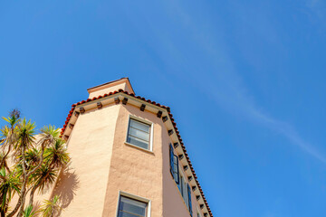 Low angle view of a house with cream peach paint exterior in San Francisco, California