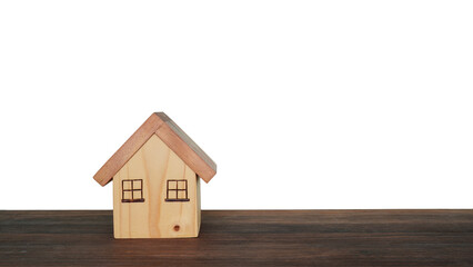 Obraz na płótnie Canvas Model of a small wooden house on a white background