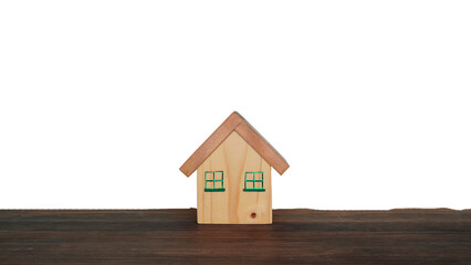 Obraz na płótnie Canvas Model of a small wooden house on a white background