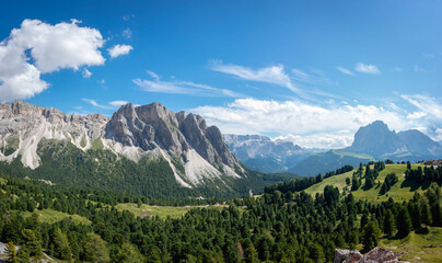 Fototapeta na wymiar Seceda Mountains in the Dolomites, Trentino Alto Adige, Val di Funes Valley, South Tyrol in Italy, Odle Mountains in the background, Italy.
